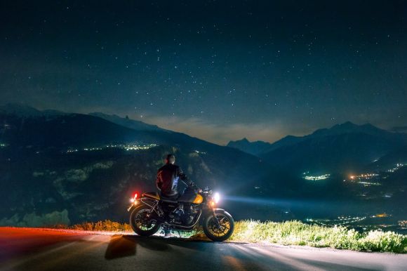 Motorcycle - man siting on motorcycle at night