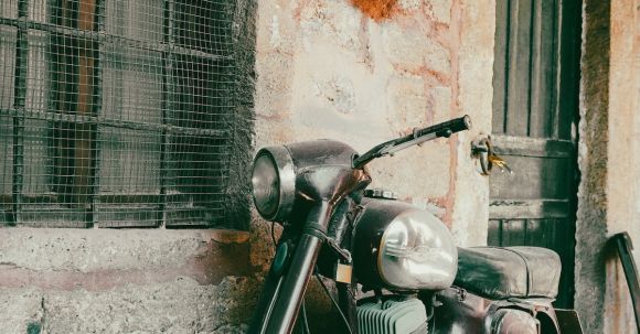 Motorcycle Endorsements - A Vintage Motorcycle Parked on the Sidewalk