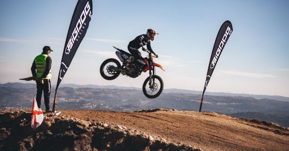 Motorcycle Safety Course - A Man Riding a Motocross Dirt Bike Jumping from a Ramp