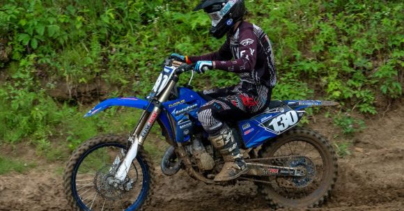 Moto Riding - Man riding a Motocross on Muddy Dirt Road