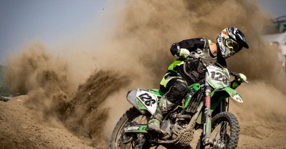 Adaptive Motorcycles - Rider Riding Green Motocross Dirt Bike