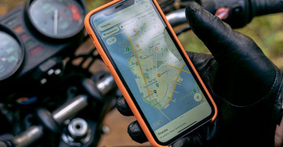 Motorcycle Navigation. - A Person Holding a Smartphone