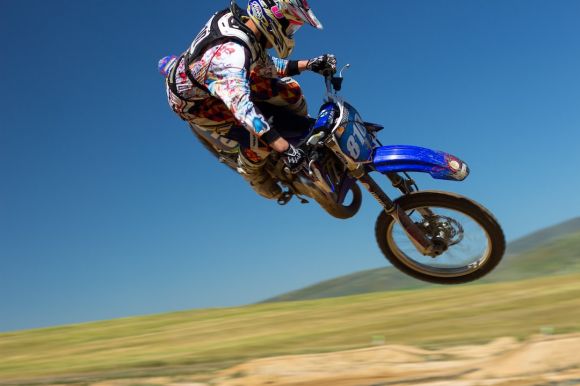 Sport Motorbikes - man doing motorcycle air stunt during daytime
