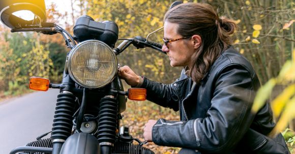 Motorcycle Maintenance - Man in Black Leather Jacket Sitting on Motorcycle