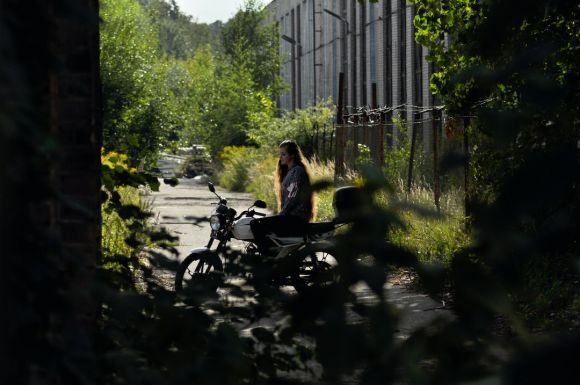 Moto Riding - woman sitting on parked motorcycle