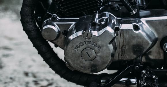 Moto Riding - Motorcycle parked on sandy road outside