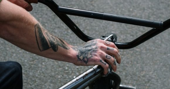 Bike Maintenance Tips - Man fixing a Bike