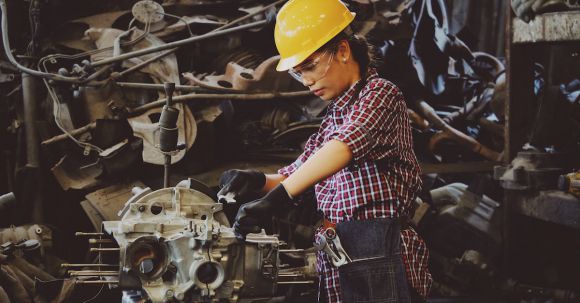 Maintenance Tips - Woman Wears Yellow Hard Hat Holding Vehicle Part