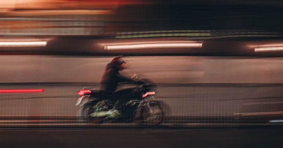 Motorcycle Campgrounds - Man Riding Motorcycle on Road during Night Time