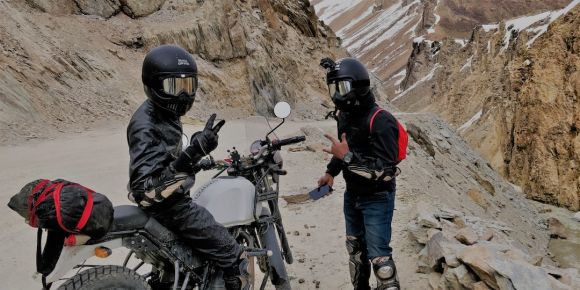 Moto Gear - person standing beside motorcycle