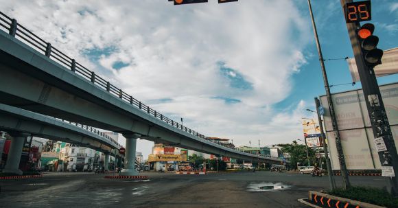 Highway Rules - Low angle of empty asphalt crossroad with red traffic light with timer in center of city