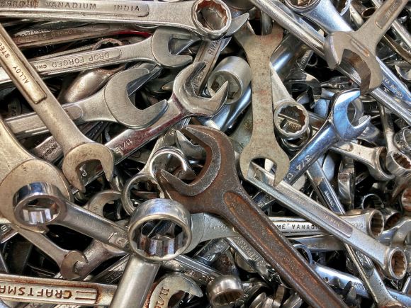 Motorcycle Maintenance - a pile of wrenches sitting next to each other