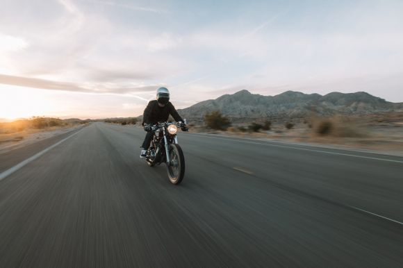 Motorcycle - man riding motorcycle on road during daytime