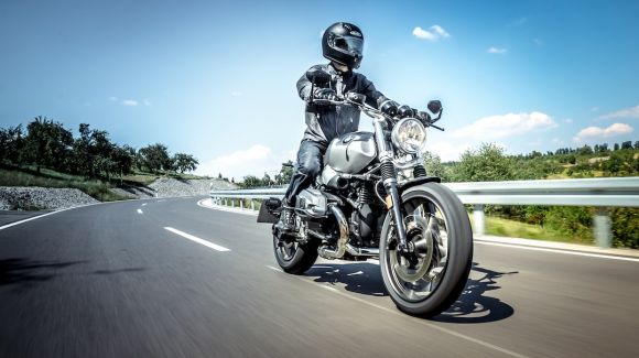 Motorcycle - man in black helmet riding on black motorcycle on road during daytime