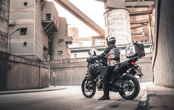 Motorcycle Tour - man in black motorcycle helmet riding black motorcycle during daytime