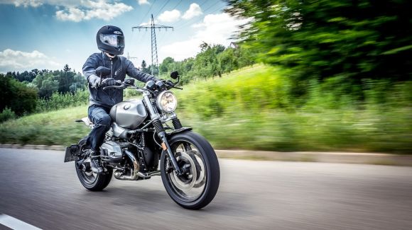 Moto Riding - man in black motorcycle helmet riding motorcycle on road during daytime