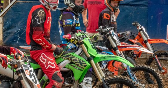 Motorbike Preparation - Motocross Bikers Waiting at the Starting Line