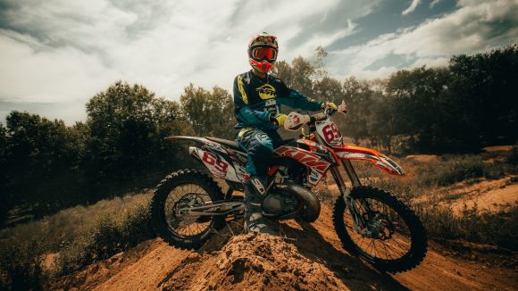 Off-road Moto Riding - man in blue and red motorcycle suit riding motocross dirt bike