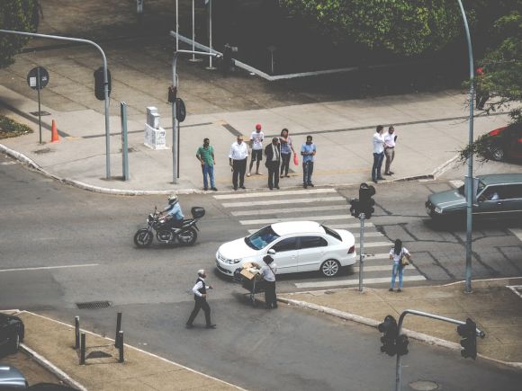 Motorcycle In Traffic - white car on ped xing