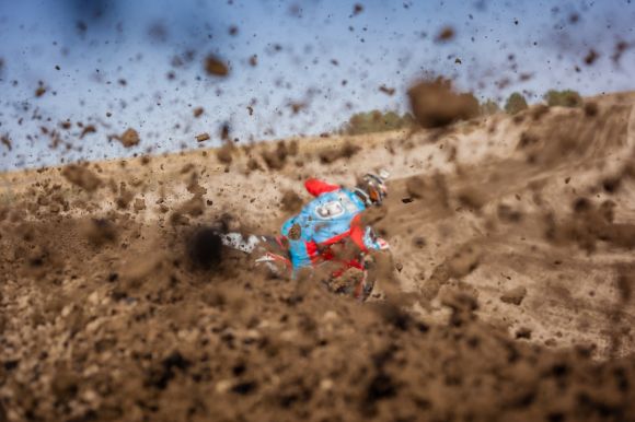 Dirt Bike - selective focus photography of man riding motorcycle on dirt road