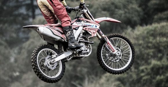 Motorcycle Exhaust Laws - Man Performing Motocross Stunt