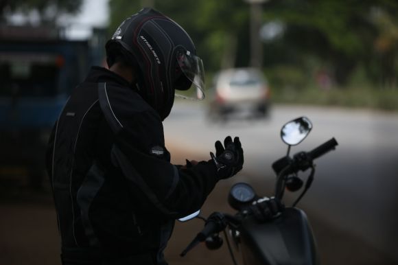Motorcycle Gear - selective focus photo of man wearing motorcycle suit