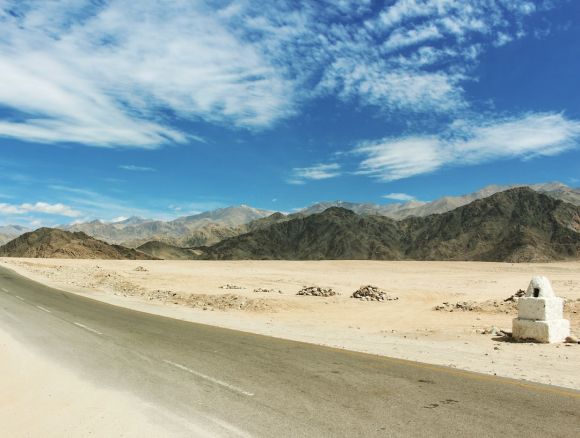 Off-road Moto Riding - gray concrete road with range mountain view