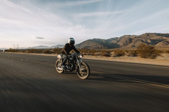 Motorcycle - man riding motorcycle on road during daytime