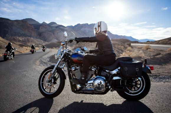 Motorcycles - man riding touring motorcycle during daytime