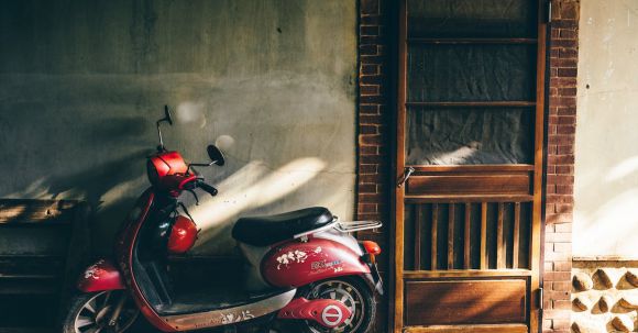 Motorcycle Compliance Tips - Scooter Parked in front of a House