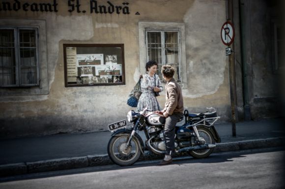 Motorcycle In City - a man and a woman sitting on a motorcycle