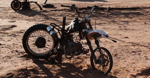 Moto Riding - Motorbike placed on dry ground in rough terrain