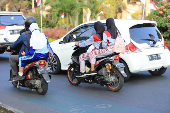 Motorcycle Maintenance - a group of people riding on the back of motorcycles