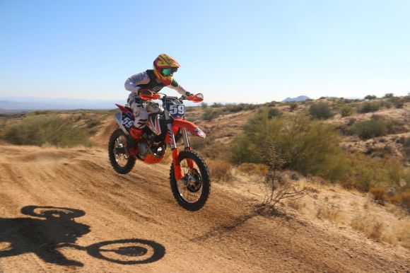 Dirt Bike - man drives motocross bike downhill