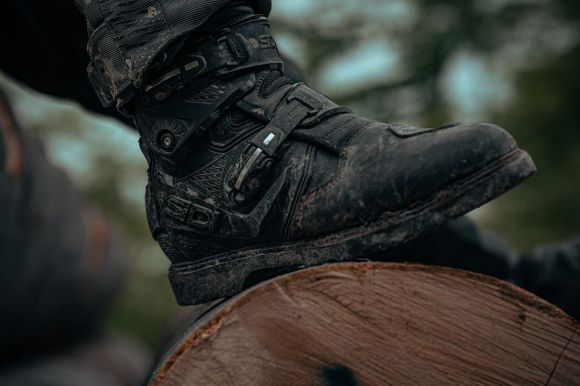 Moto Shoes - a close up of a person riding a horse