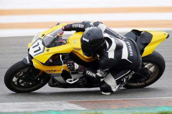 Motorcycle Helmet - person riding a black sports bike