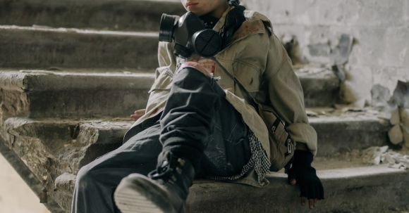 Post-accident Steps - Boy in Brown Jacket Sitting on Concrete Staircase