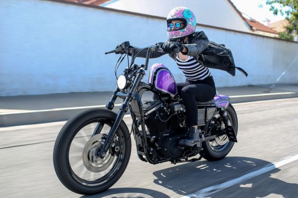 Motorcycle Helmet - man in black and white jacket riding black motorcycle during daytime