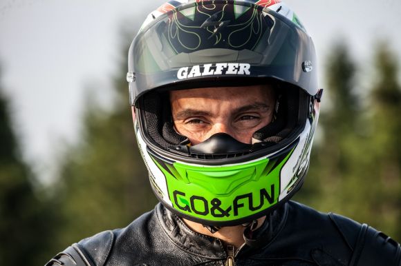 Motorcycle Helmet - man wearing black multicolored helmet