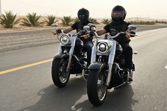 Motorcycle Helmet - black and silver motorcycle on road during daytime