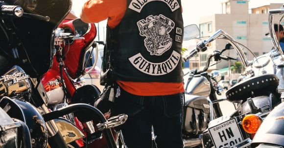 Motorcycle Safety - Man Standing Surrounded by Motorcycles