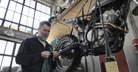 Motorcycle Inspections - Man in Black Jacket Standing Beside Black Motorcycle