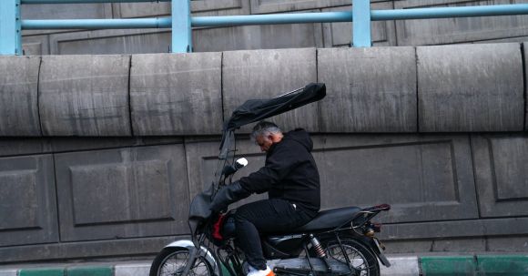 Motorcycle Wind Protection: Best. - Man Riding Motorcycle on City Street